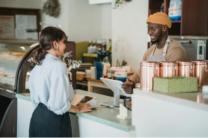 Young professional ordering coffee