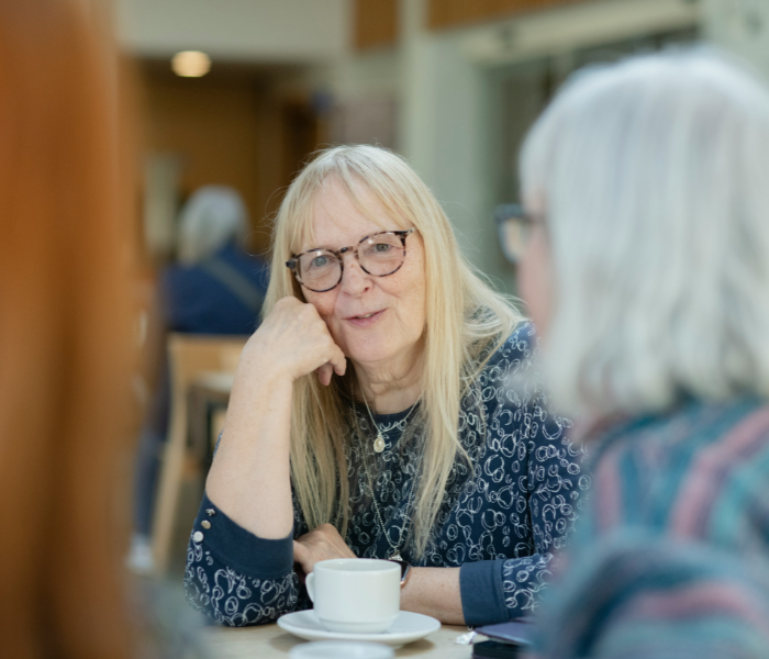 Woman listening intently to friends