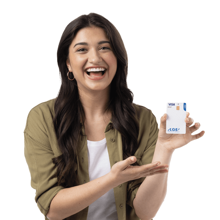 Young woman smiling enthusiastically and gesturing to the white LGE debit card she holds in her left hand. She has long wavy brown hair, thin gold hoop earrings, and wears an olive-colored button-down shirt over a white t shirt.